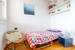 Posteľ alebo postele v izbe v ubytovaní attico in un'oasi di verde sui navigli - NavigliApartments