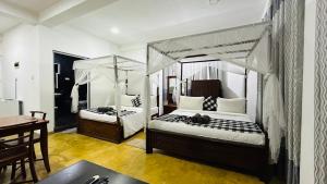 Postel nebo postele na pokoji v ubytování O2 Villas-Weligama