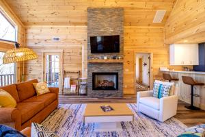 a living room with a couch and a fireplace at Moksha Retreat in Black Mountain