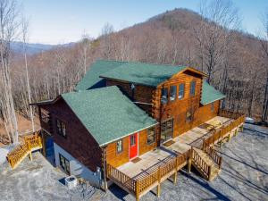 an overhead view of a log cabin with a deck at Moksha Retreat in Black Mountain