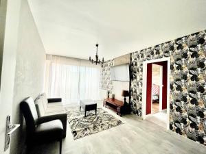 Posezení v ubytování Bel appartement lumineux avec balcon 1 chambre
