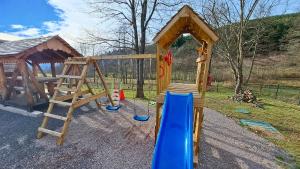 a small playground with a slide and a slideintend at Gîte & Spa PRIVÉ "La Colline de Laveline" Proche GÉRARDMER in Laveline-du-Houx
