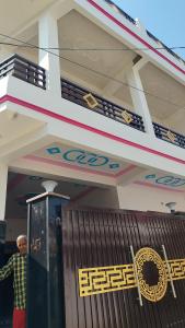 a man standing in the doorway of a building at Ravi villa in Prayagraj