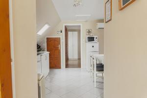 A kitchen or kitchenette at Bianka Apartman