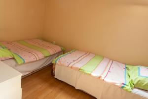 A bed or beds in a room at Bianka Apartman