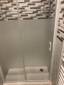 a shower with a glass door in a bathroom at Lappart in Juvigny-en-Perthois
