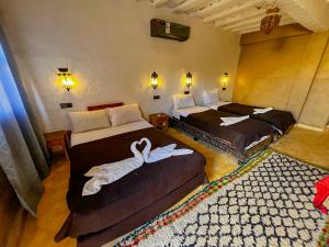 Cama o camas de una habitación en Kasbah Erg Chebbi
