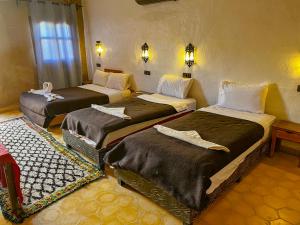 Cama o camas de una habitación en Kasbah Erg Chebbi