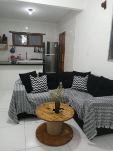 a living room with a couch and a table at River House in Marau