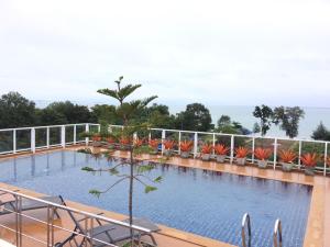 a swimming pool on the roof of a building at Room Mae Phim Beach - Monthly Rent in Chak Phong