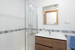 a bathroom with a sink and a shower at Mi Casa es Tu Casa - Malaga Center - Fiber WiFi in Málaga +16 photos