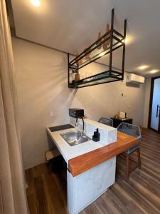 a kitchen with a sink in a room at Casas Oba in Morro de São Paulo +87 photos