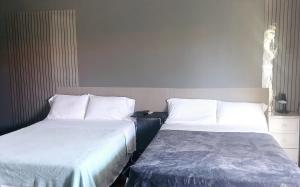Postel nebo postele na pokoji v ubytování La casita de Issa via Boquete