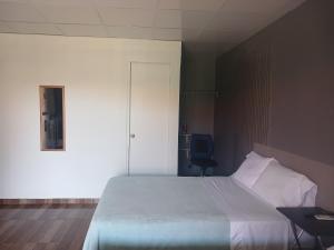 Postel nebo postele na pokoji v ubytování La casita de Issa via Boquete