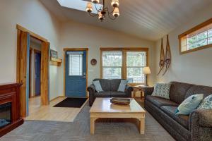 a living room with a couch and a coffee table at Huckleberry Cottage in Bend