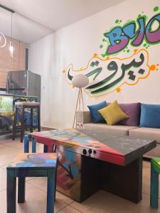 a living room with a couch and a table at Byout Beirut G3 in Beirut