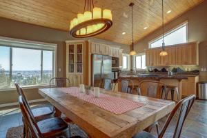 a kitchen with a large wooden table and chairs at Golden Butte in Bend