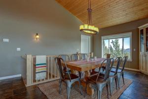 a dining room with a wooden table and chairs at Golden Butte in Bend