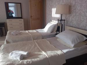 Postel nebo postele na pokoji v ubytování Hotel Marliza