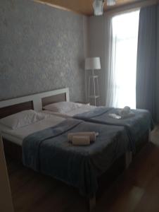 Postel nebo postele na pokoji v ubytování Hotel Marliza