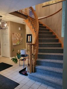a stairway in a home with a wooden staircase at 308 Delancey in Hamilton