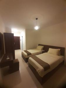 Katil atau katil-katil dalam bilik di Traveller Namma bay