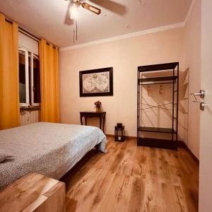 a bedroom with a bed and a mirror at La Caravella apartament in Rapallo +14 photos