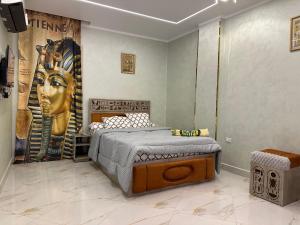 Krevet ili kreveti u jedinici u objektu Hapi Pyramids Hotel