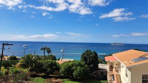 a view of the ocean from a house at OCEAN VIEW APARTMENTs in Belmont +4 photos