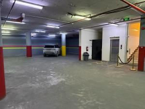 a parking garage with a car parked in it at بارك زون للشقق المخدومة Park Zone Serviced Apartments in Riyadh