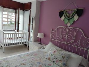 Postel nebo postele na pokoji v ubytování Apartamento Noja Beach