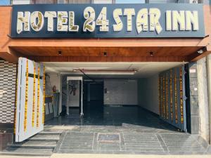 an entrance to a hotel star inn at Hotel 24 STAR INN in Jāmb +13 photos
