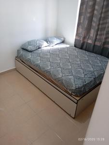 a bed sitting in a room with at Casa arcilla clima total Starlink zona Aeropuerto in Villa Juárez
