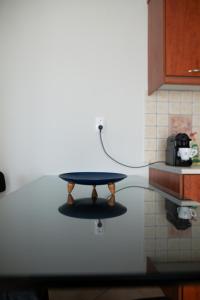 a table in the middle of a kitchen with a ping at Igoumenitsa View - Marinos in Igoumenitsa