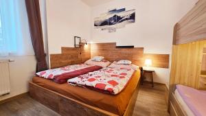 Postel nebo postele na pokoji v ubytování Apartmán U Bejka