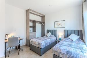 Postel nebo postele na pokoji v ubytování Camino de Olivos - Desayuno Incluido y Aire Acondicionado