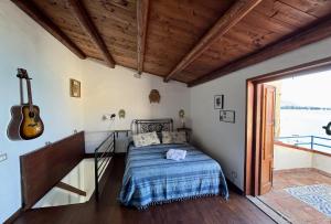 A bed or beds in a room at Terrazza del Mare (by Vacation Service)