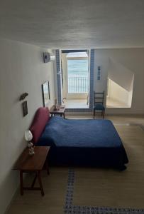 A bed or beds in a room at Terrazza del Mare (by Vacation Service)