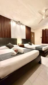 Ένα ή περισσότερα κρεβάτια σε δωμάτιο στο Hotel Baroni
