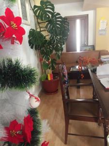 a living room with a christmas tree and a desk at Vila Aosta 21 in Sinaia +31 photos