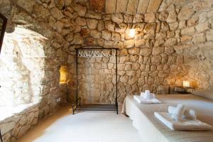 Postel nebo postele na pokoji v ubytování Agriturismo Le Fornelle