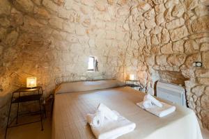 Postel nebo postele na pokoji v ubytování Agriturismo Le Fornelle