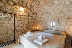 Postel nebo postele na pokoji v ubytování Agriturismo Le Fornelle