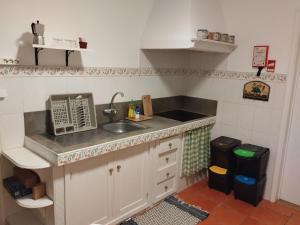 a kitchen with a sink and a counter top at Sea U in Lagoa +9 photos
