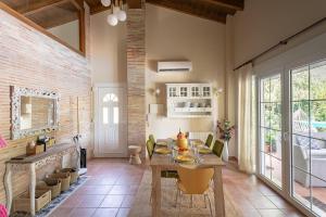 a dining room with a table and chairs at Luxury villa close to beach, mountain and golf! in Alzira