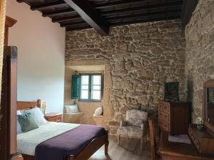 Postel nebo postele na pokoji v ubytování Casa Grande de Cristosende