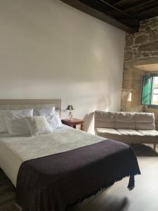 Postel nebo postele na pokoji v ubytování Casa Grande de Cristosende