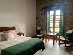Postel nebo postele na pokoji v ubytování Casa Grande de Cristosende + 37 fotografií