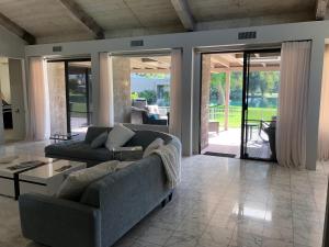 a living room with a couch and a table at Cloud Nine in Rancho Mirage