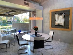 a dining room with a table and chairs at Cloud Nine in Rancho Mirage +23 photos